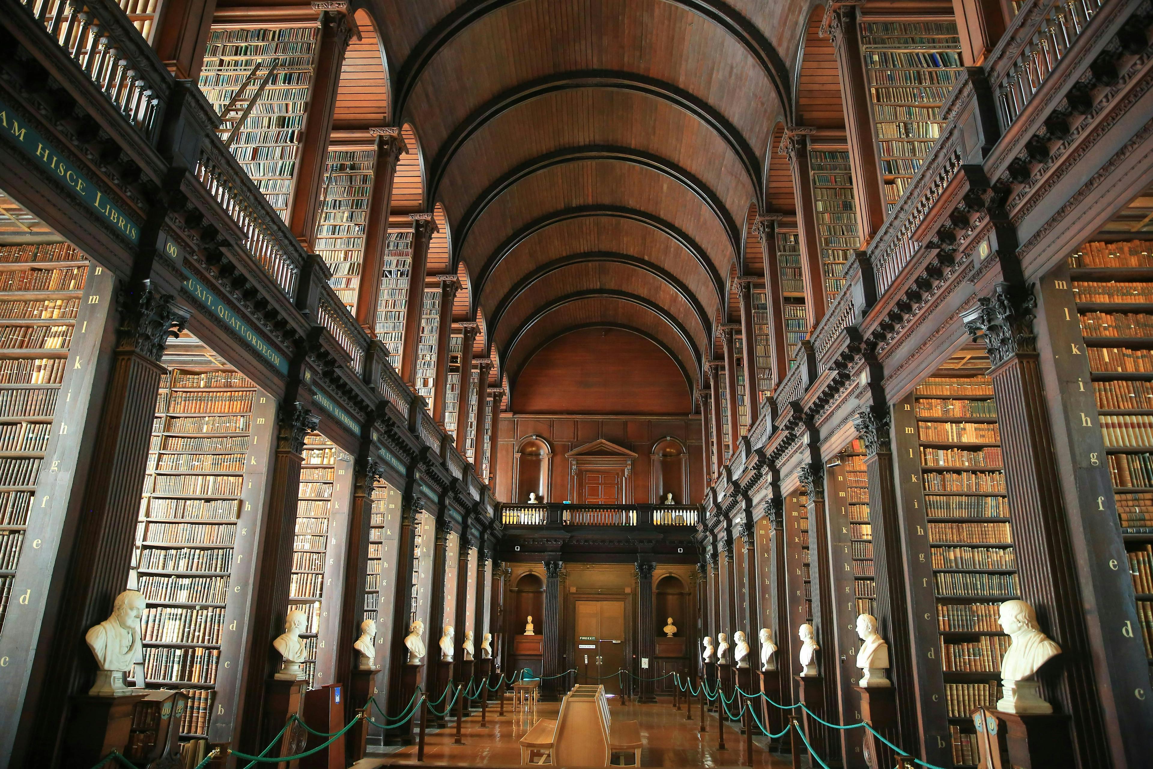 dublin,feature,illustrative,touristy,heritage,books,european cap dublin corridor architecture building flooring person human indoors aisle arch arched