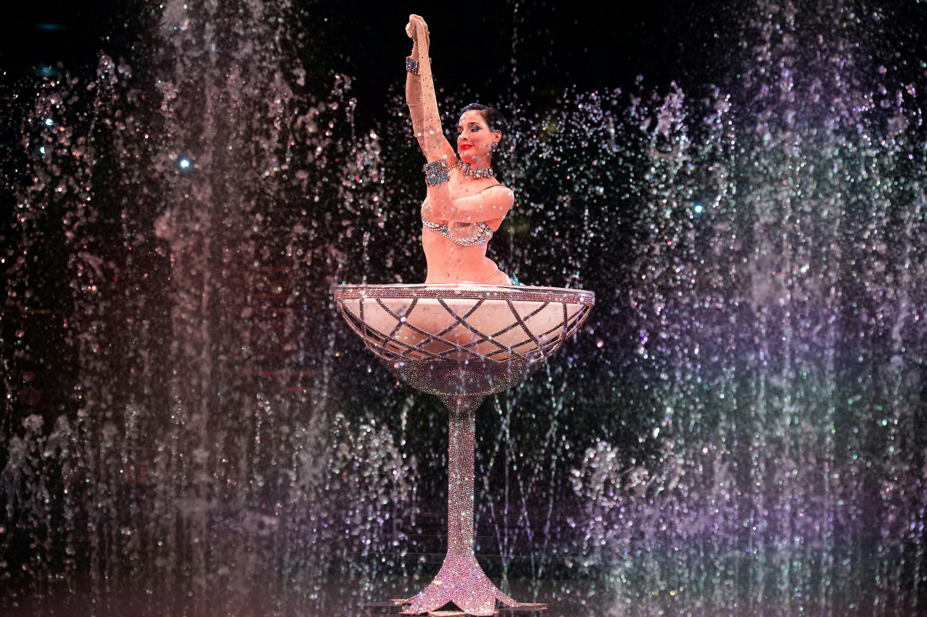 paris architecture fountain water dancing leisure activities person performer solo performance jewelry necklace