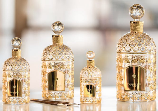 bottle cosmetics perfume gold